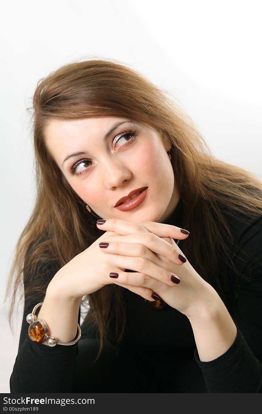 Portrait of a young woman. On the hand the amber bracelet.