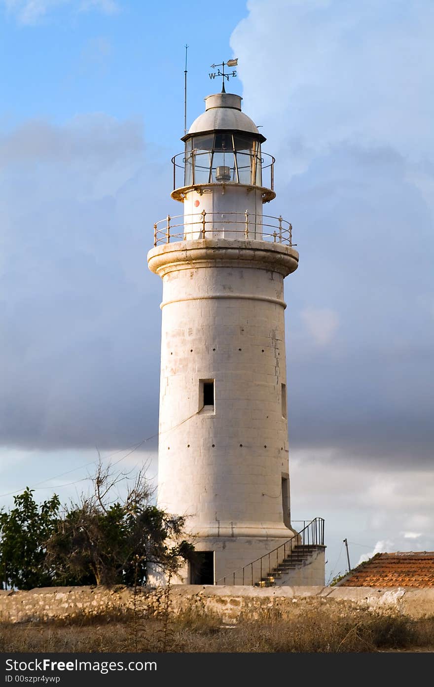 White lighthouse and blue sky. White lighthouse and blue sky