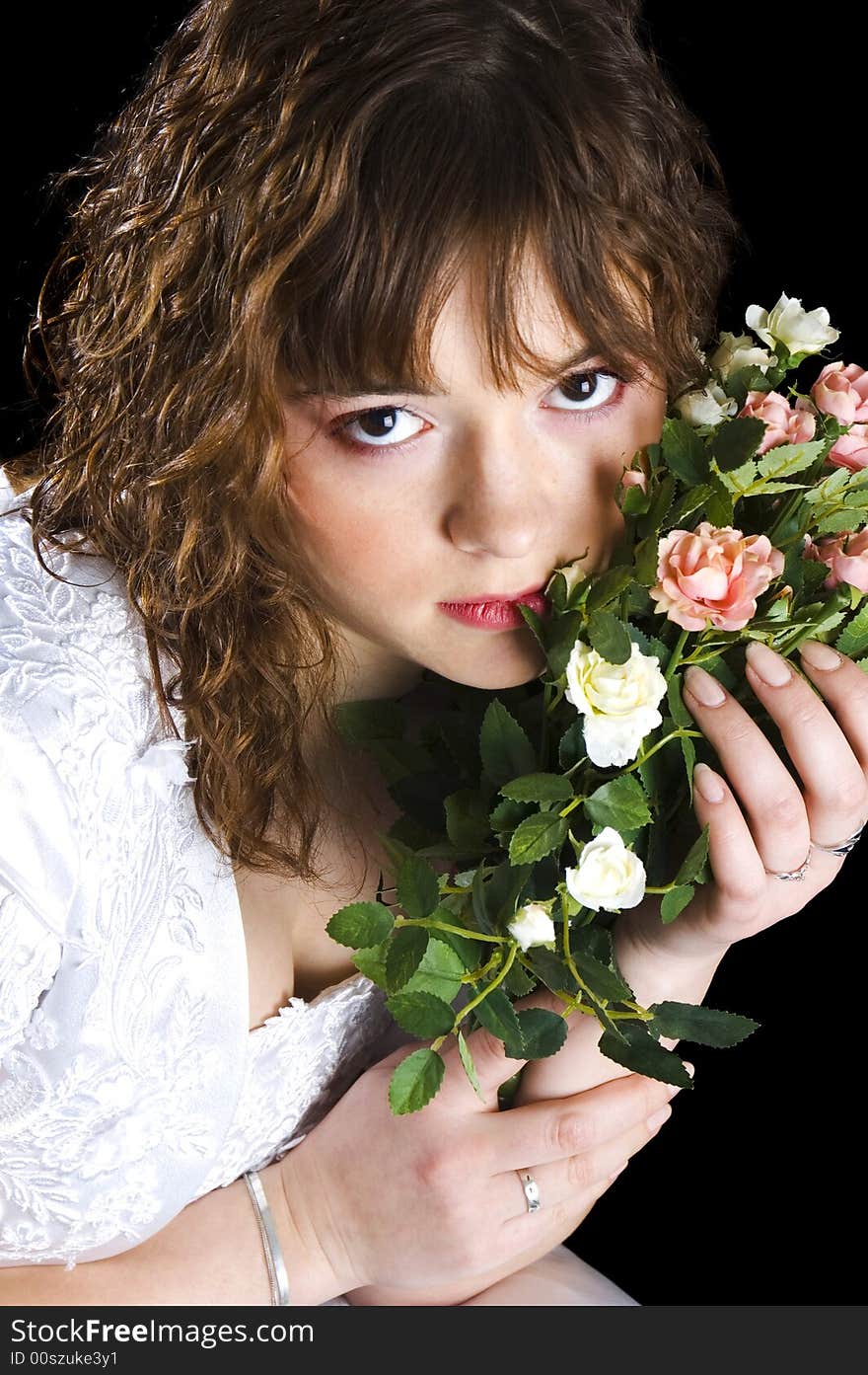 Beautiful bride with wedding bouquet of roses. Beautiful bride with wedding bouquet of roses