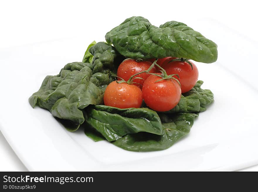 Tomato with Spinach on plate from restauraunt citchen