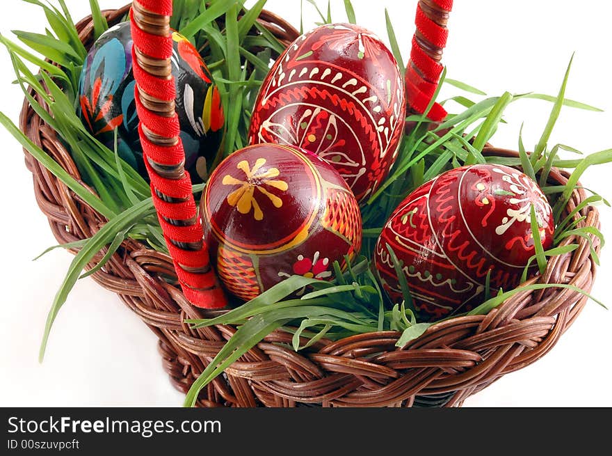 Colored Easter eggs in basket with grass. Colored Easter eggs in basket with grass