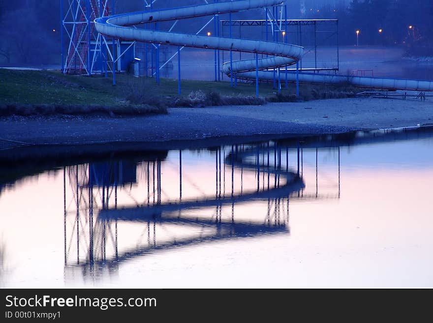 A view of a dam at dusk with reflected slide. A view of a dam at dusk with reflected slide