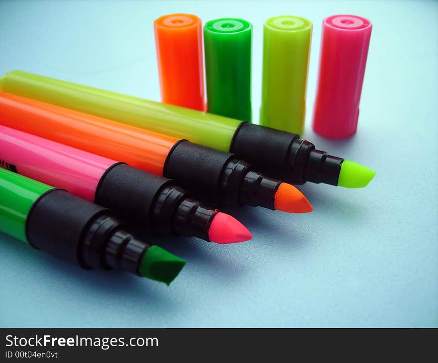 A close detail of a few plastic colored pencils. A close detail of a few plastic colored pencils