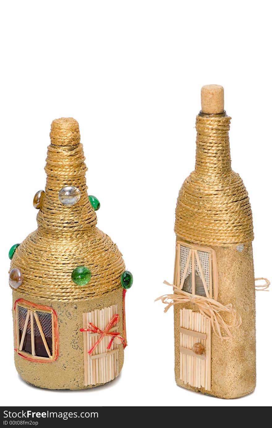 Two golden glasses decorative bottles