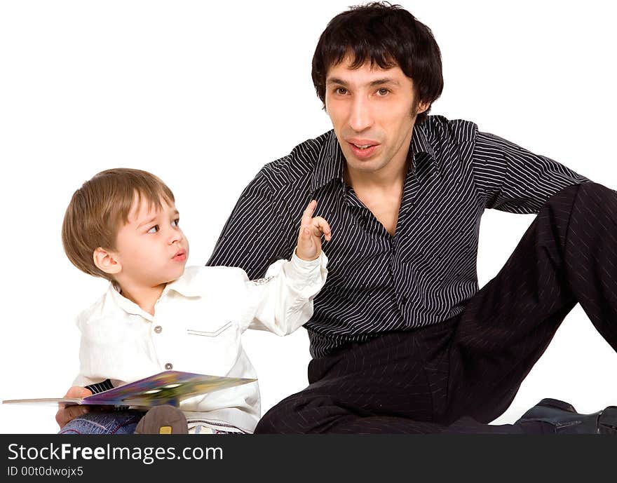 Father and son reading a book over white background