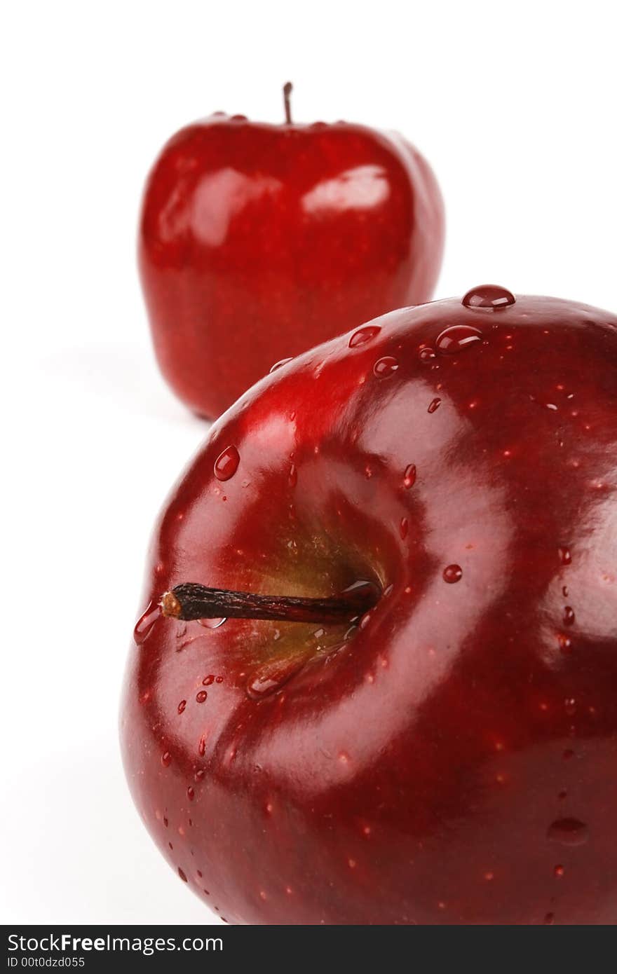 Fresh apple with drops, two red fruits