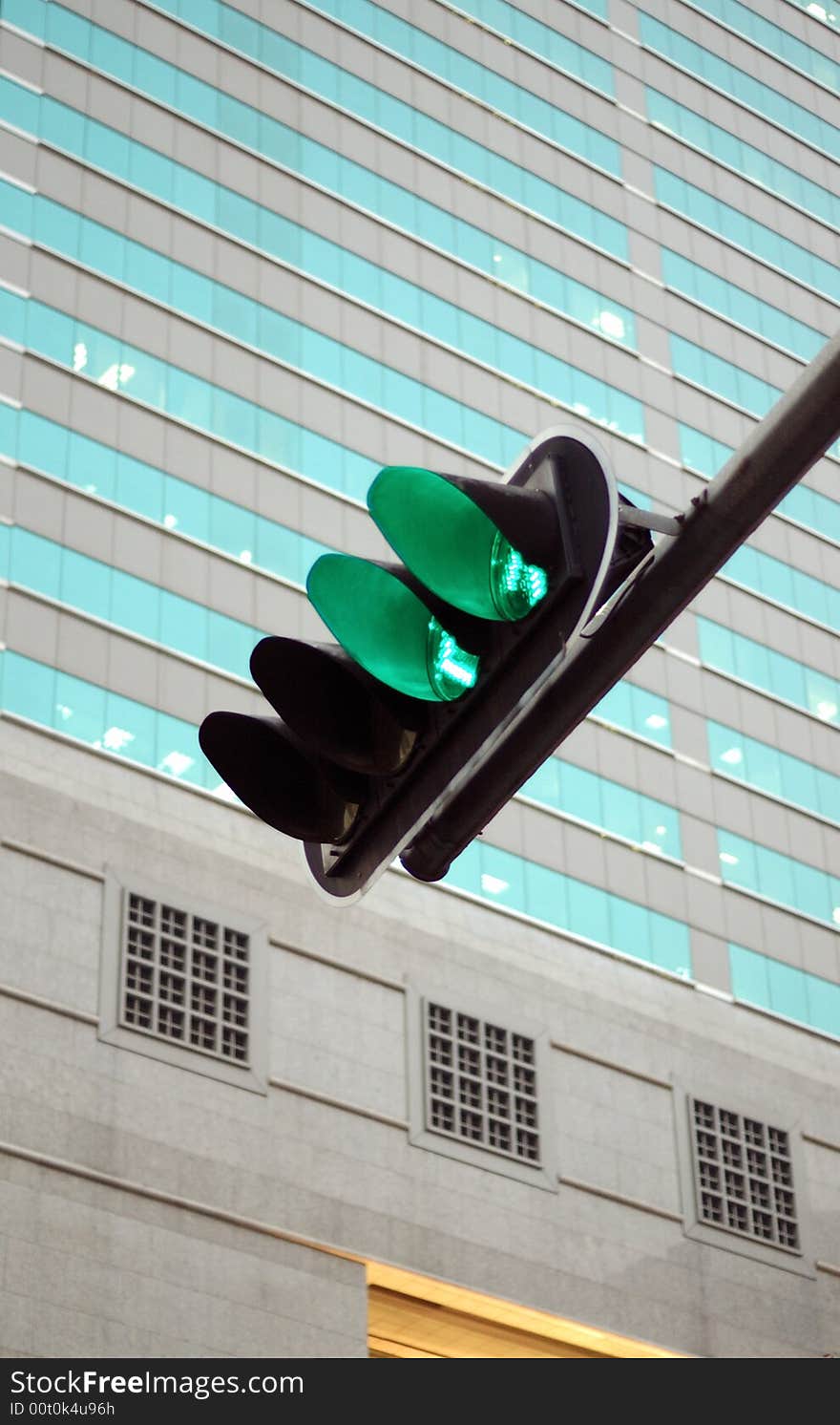 It is green traffic light and the building. It is green traffic light and the building.