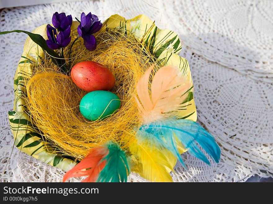 Easter eggs on the wooden plate