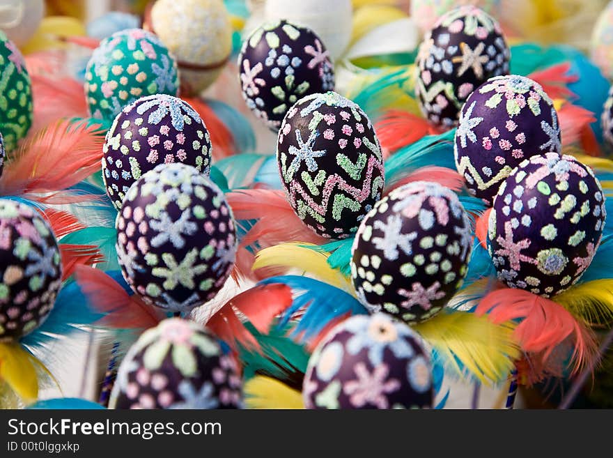 Easter eggs with colourful feathers