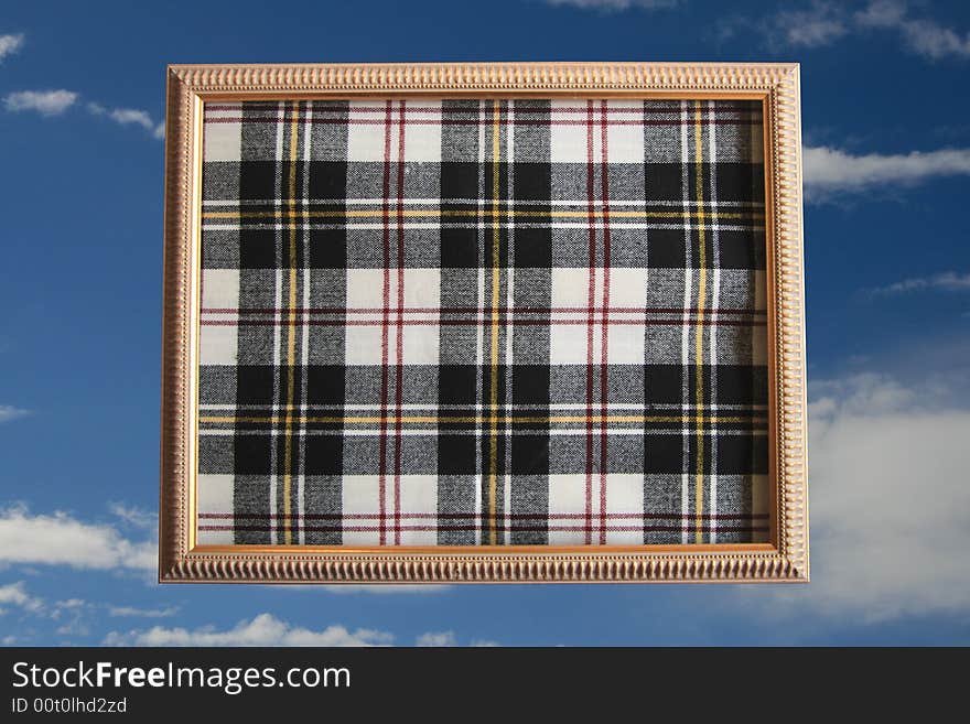 Abstract material in a picture frame against blue sky. Abstract material in a picture frame against blue sky