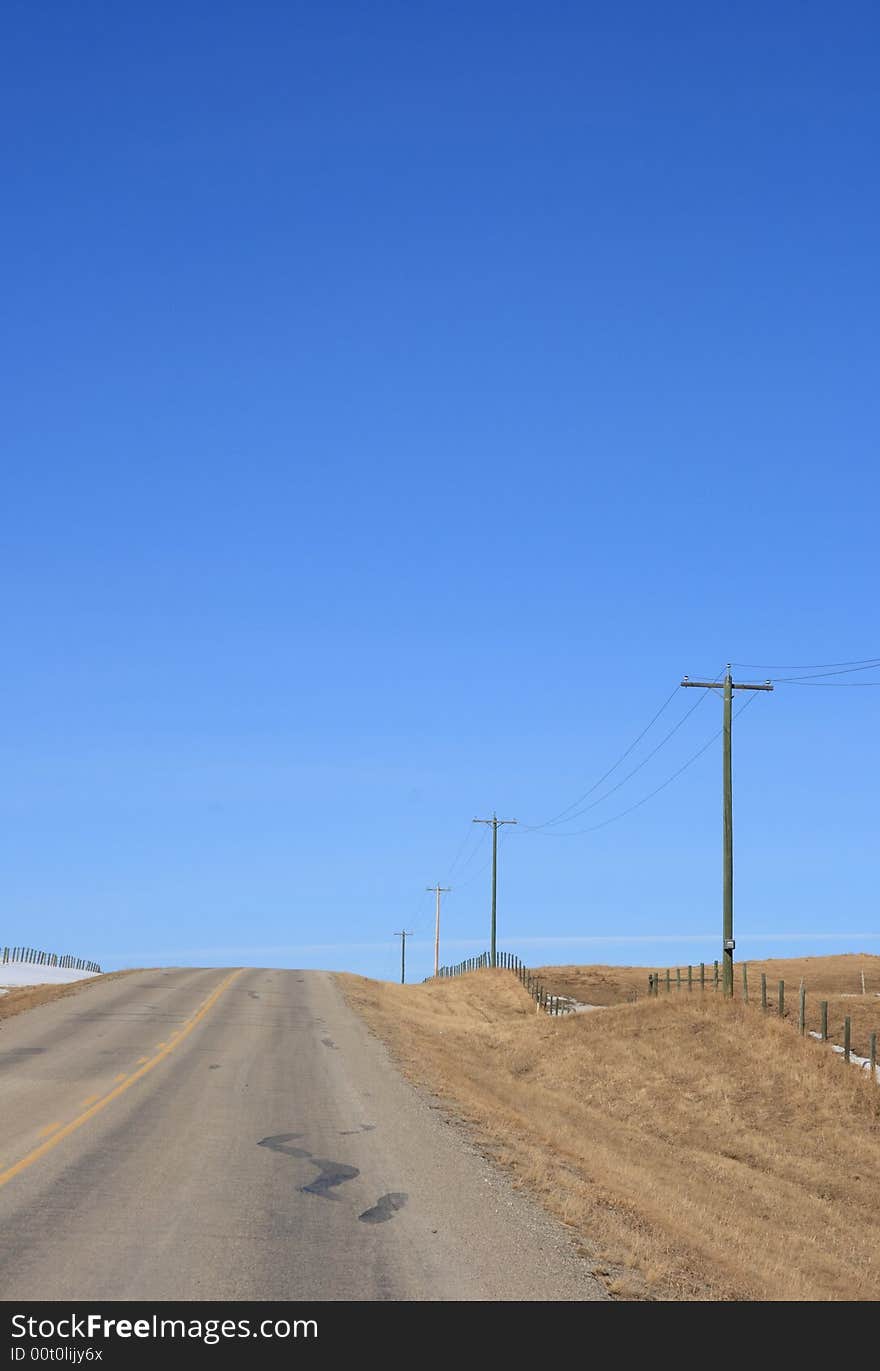 A prairie highway stretching of into the early spring