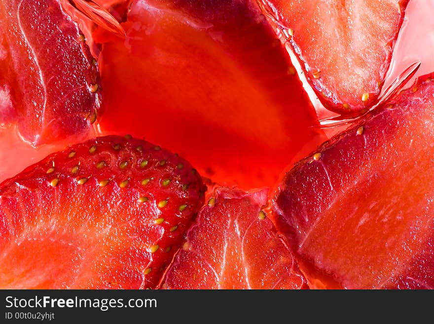 Close-up picture of jelly containing real juicy strawberries. Close-up picture of jelly containing real juicy strawberries