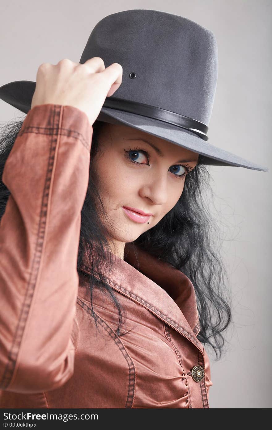 An image of a beautiful girl in felt hat