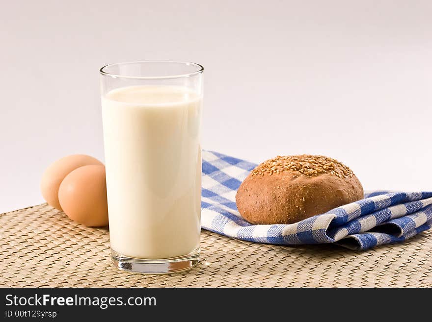 Light morning, milk with sweet bun and eggs