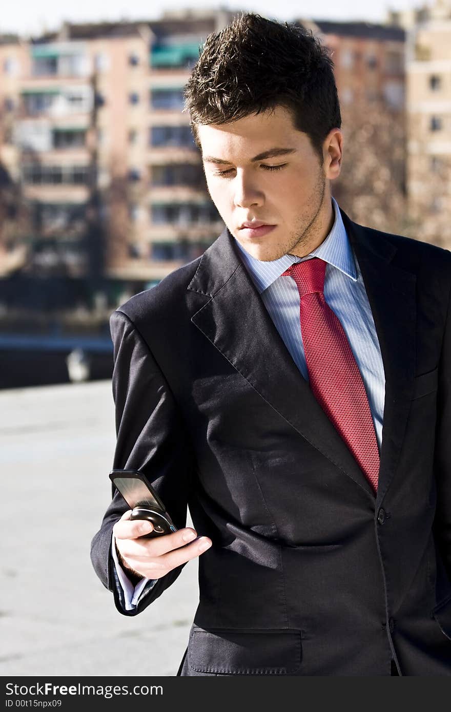 Businessman looking information at his phone. Businessman looking information at his phone