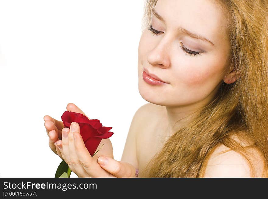 The beautiful blonde and rose close up. The beautiful blonde and rose close up