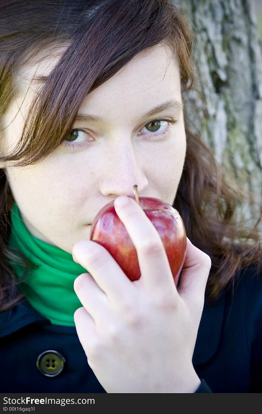 Green eyed young girl with apple. Green eyed young girl with apple