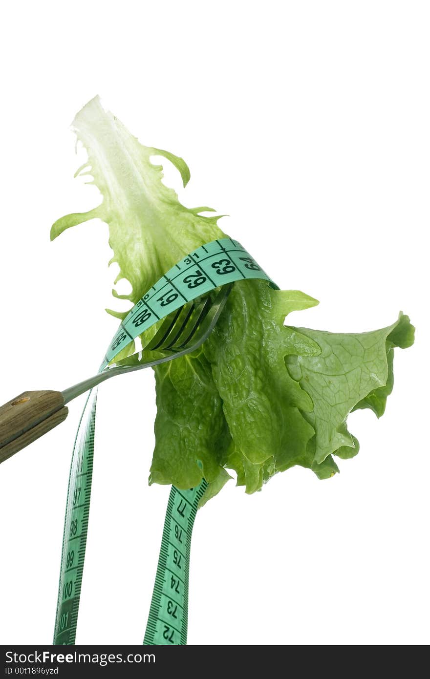 Leaf of fresh lettuce and measuring tape