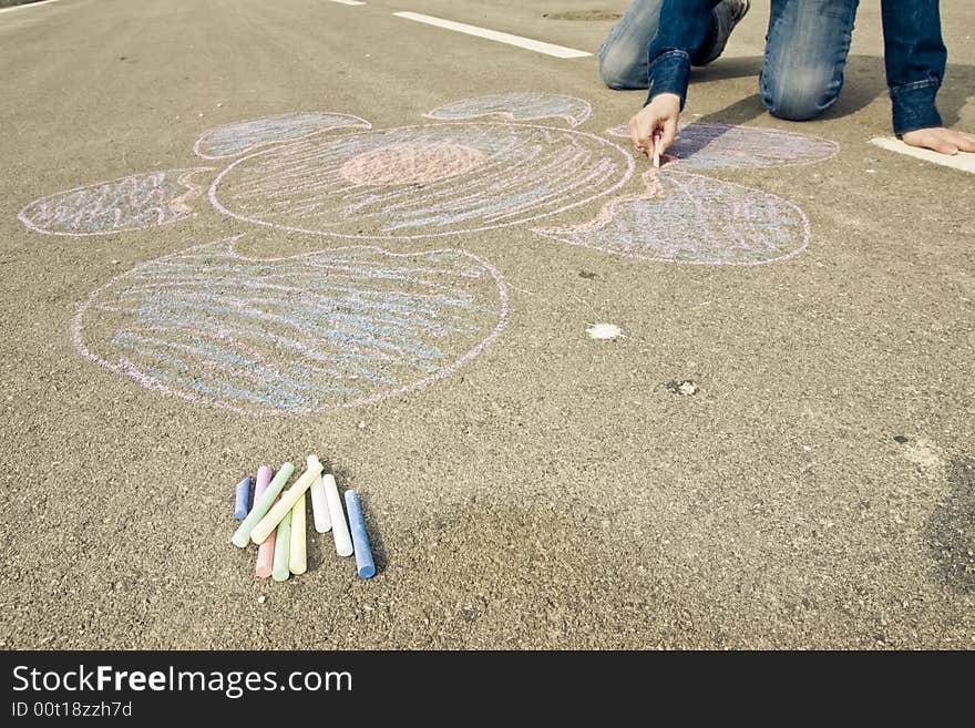 Young artist painting on the street. Young artist painting on the street