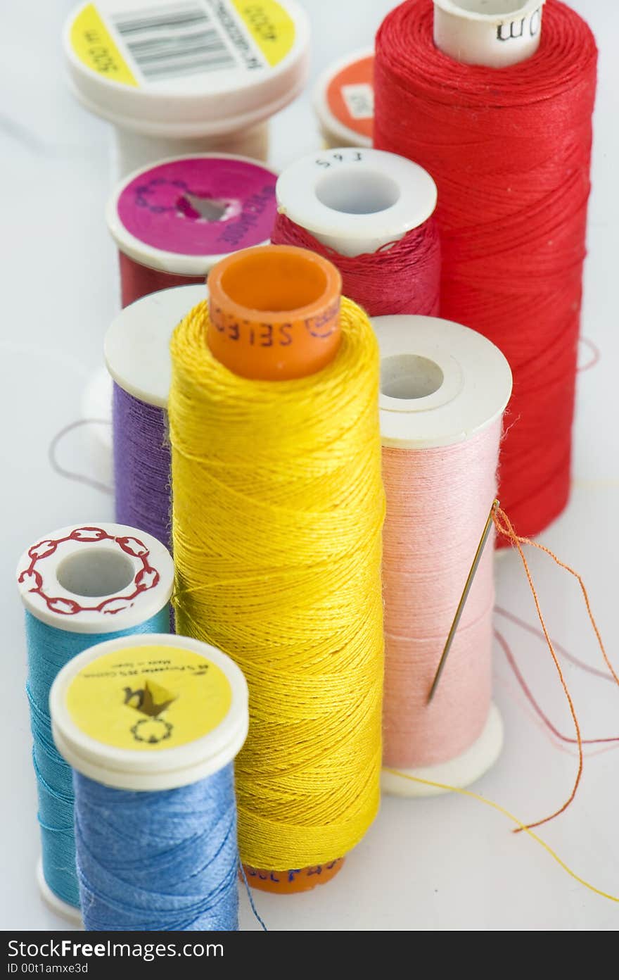 Close up of different colors of thread.