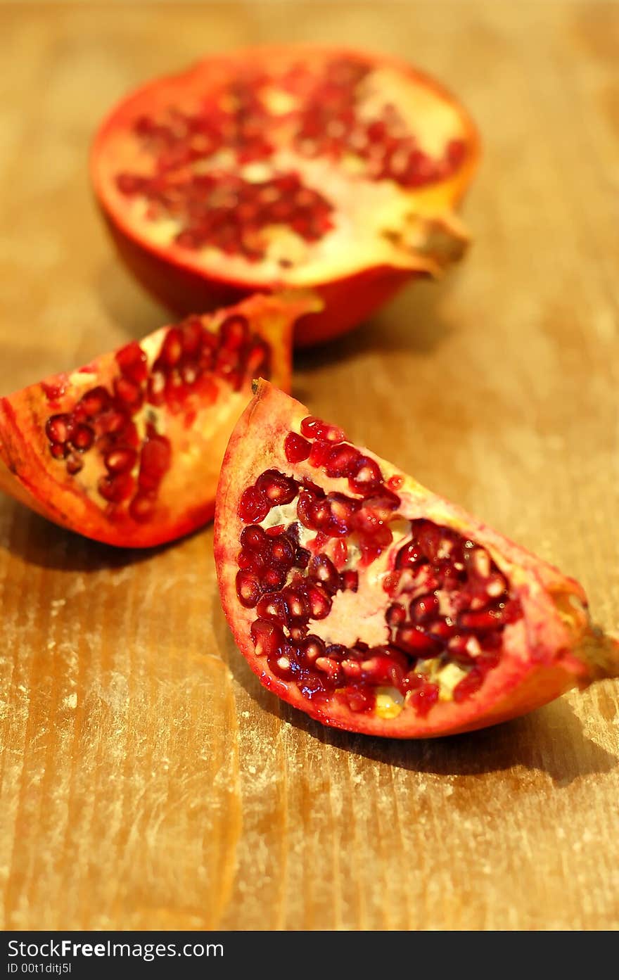 Broken ripe pomegranate fruit and seeds