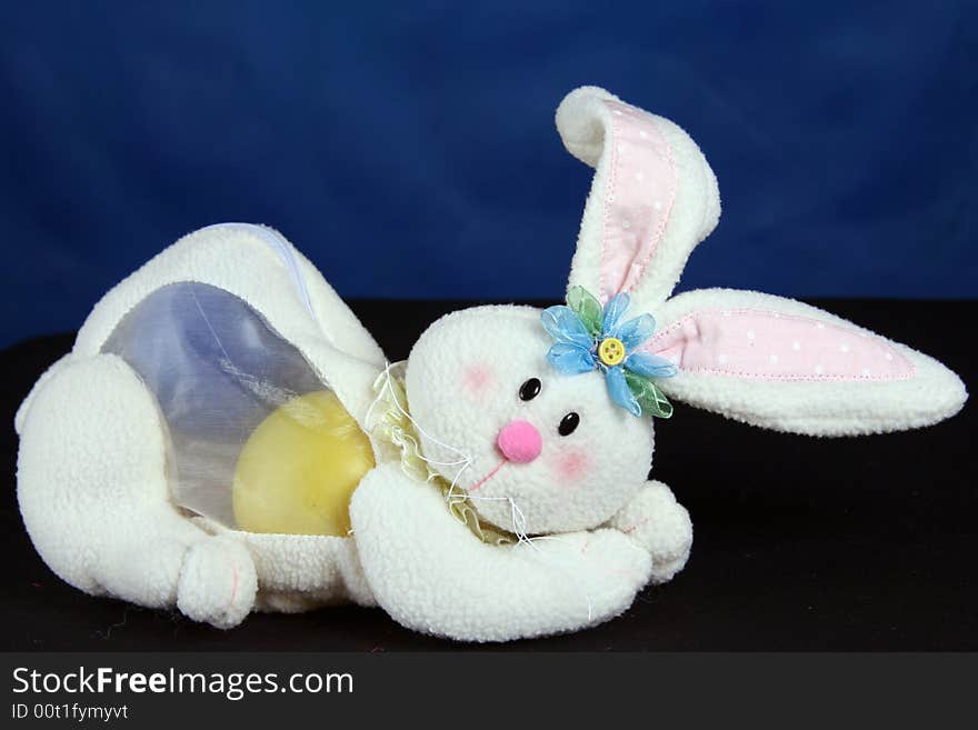 Rabbit with easter eggs over blue background. Rabbit with easter eggs over blue background