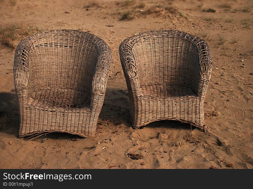 Two armchairs on the beach