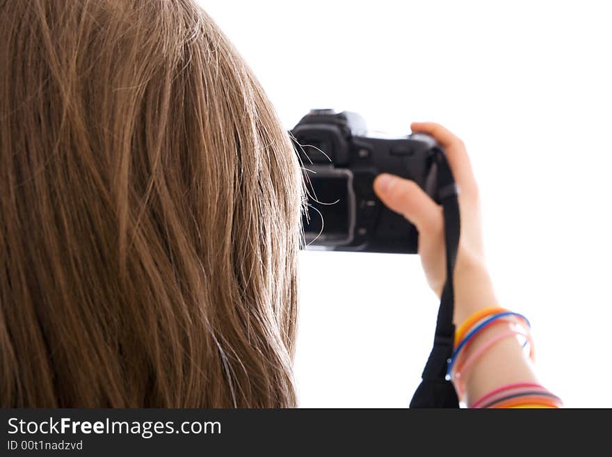 The young beautiful girl with the camera isolated on a white background