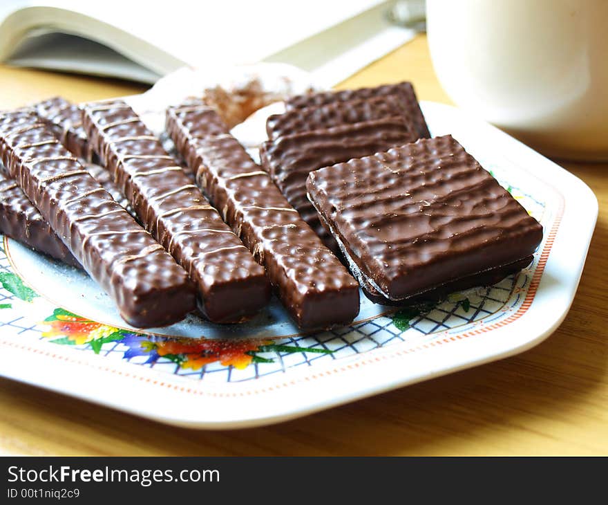 Photo of chocolate wafers on colour plate