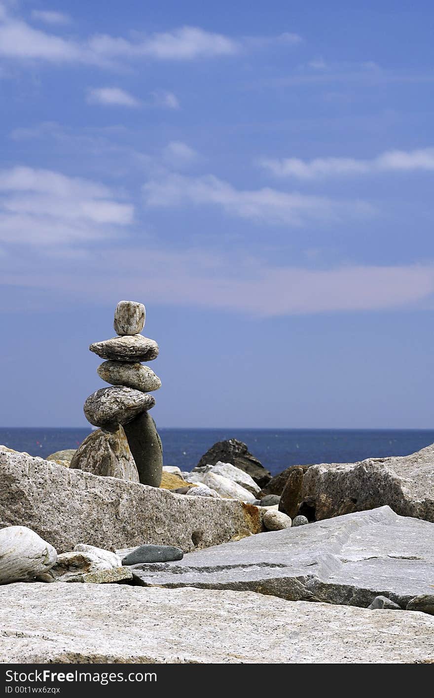 A statue constructed of rocks in the shape of a man. A statue constructed of rocks in the shape of a man