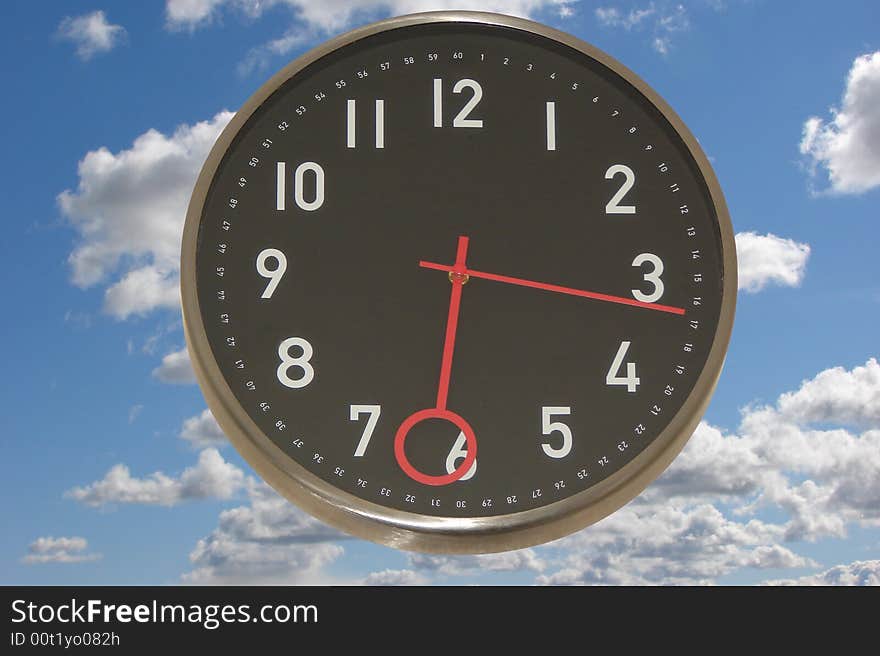 Big clock with a blue sky as a background