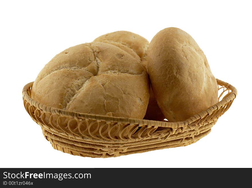 A basket of baked rolls, isolated. A basket of baked rolls, isolated