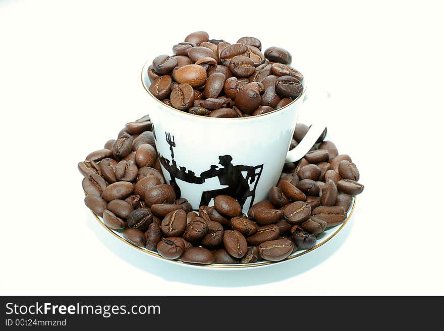 White coffee cup with coffee beans