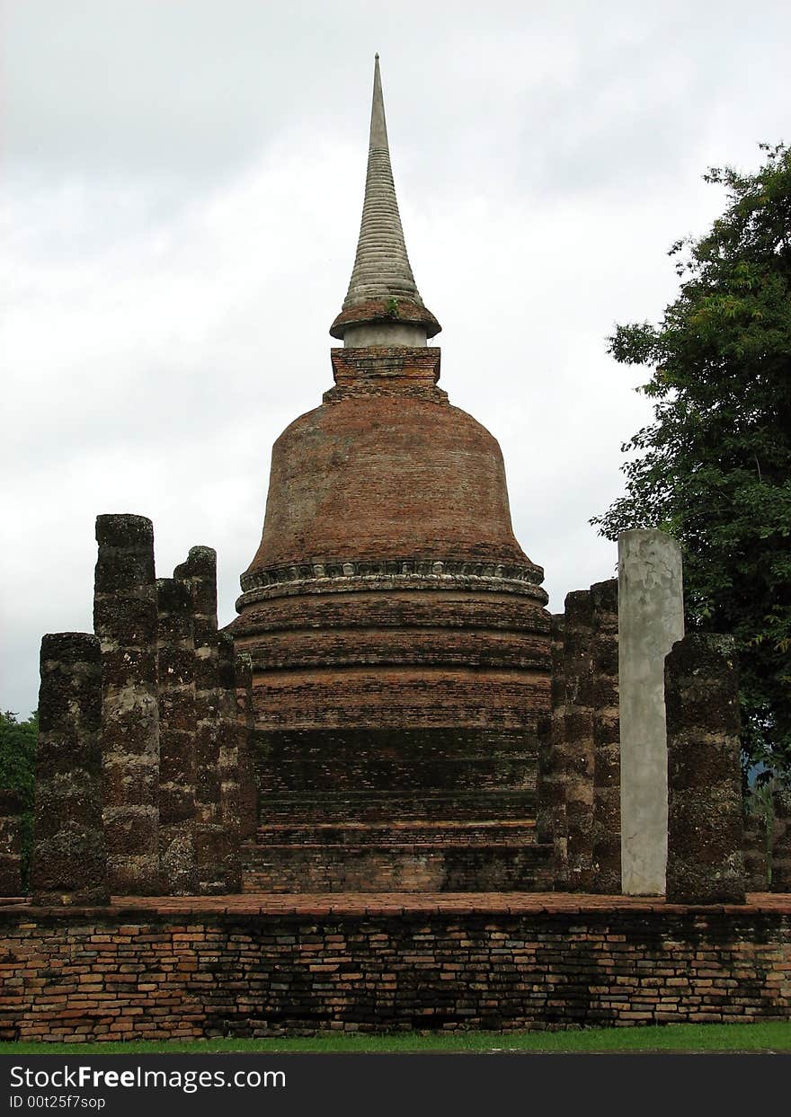 A single brick stupa in Sukhothai National Park.  Sukhothai, Thailand.