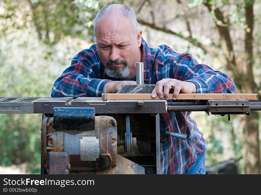 Carpenter working on tablesaw