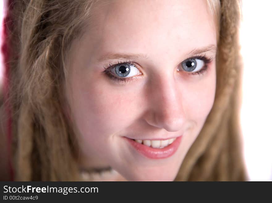 A pretty blond girl with dreads smiling at the camera. A pretty blond girl with dreads smiling at the camera