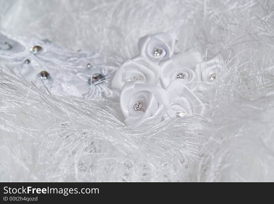 Group of wedding details on white fur background