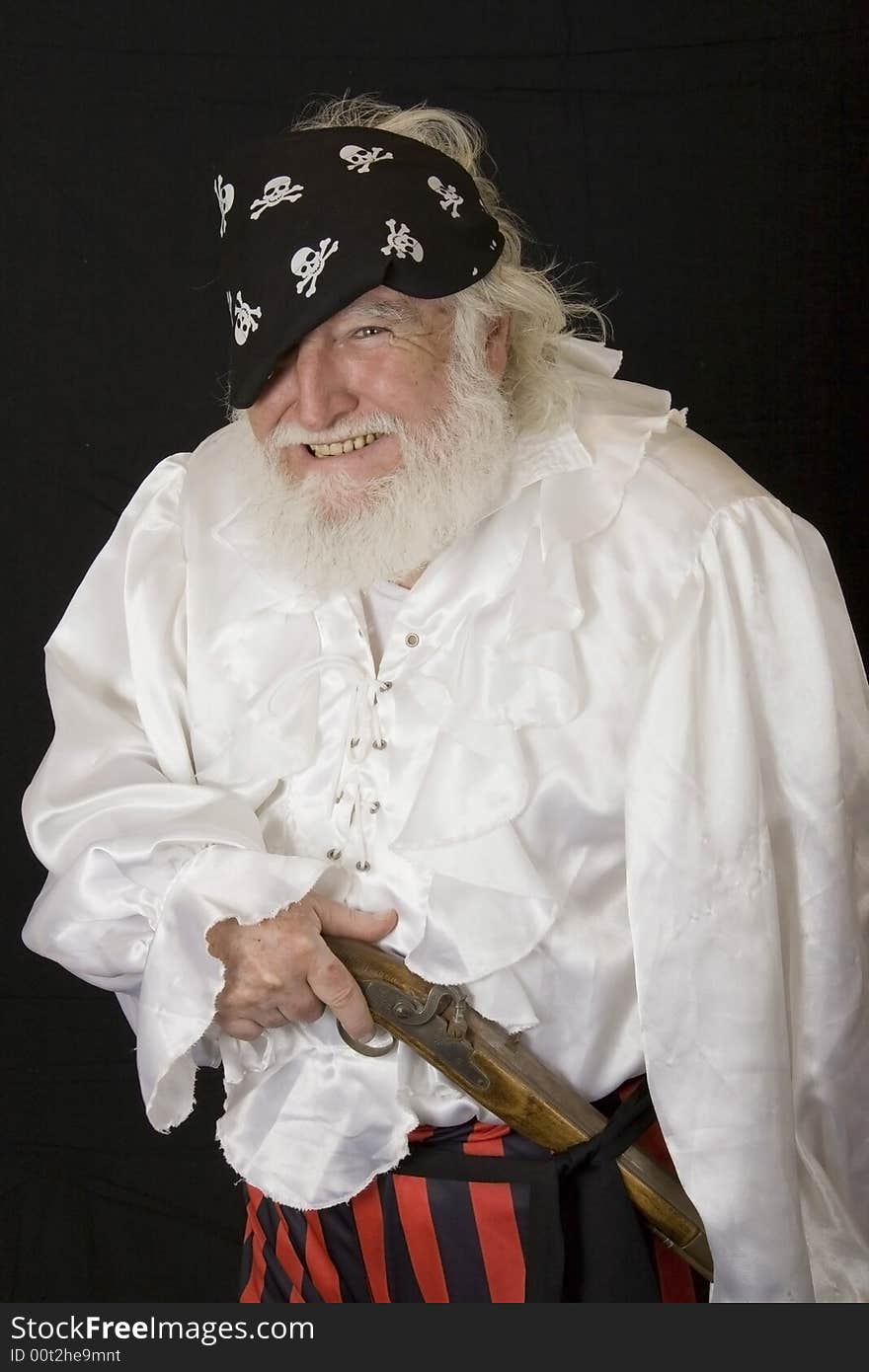 An old man dressed as a pirate. An old man dressed as a pirate