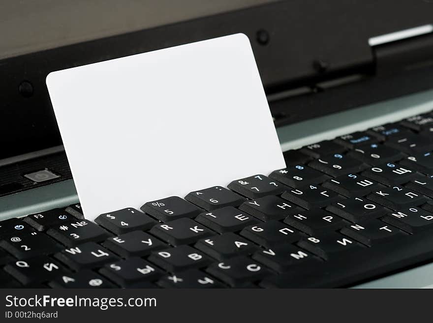 White credit card standing in keyboard