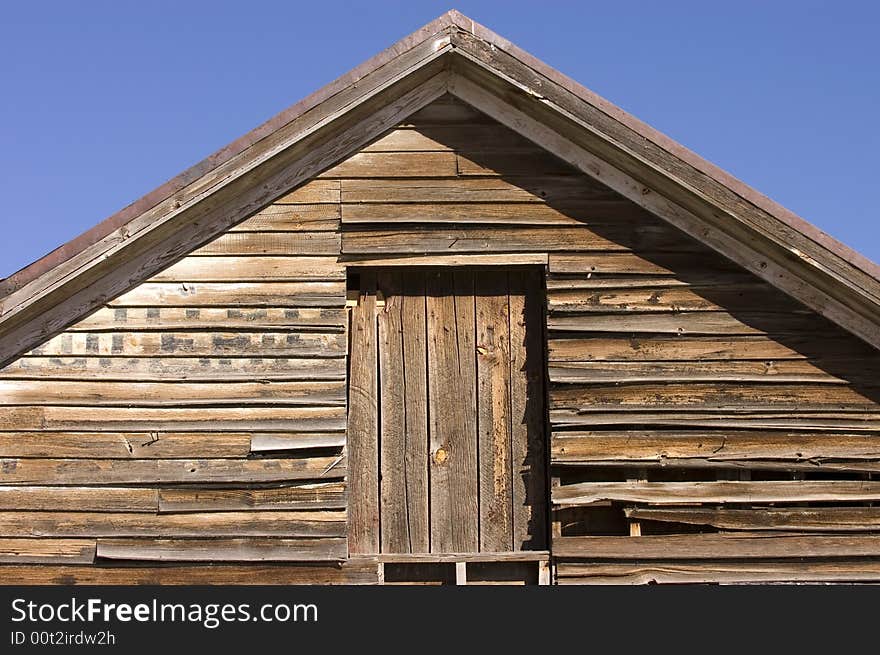 Old rustic barn in New Mexico agaisnt a blue sky