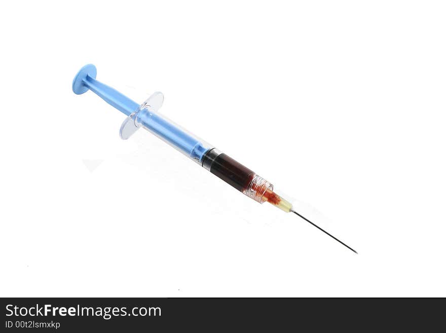 Filled blue syringe with needl