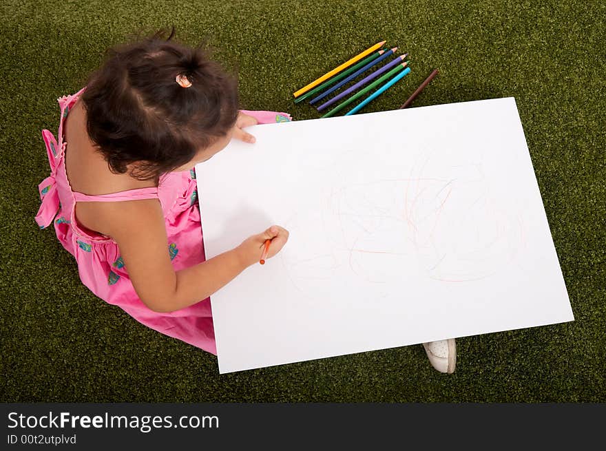 Little young girl drawing on white board