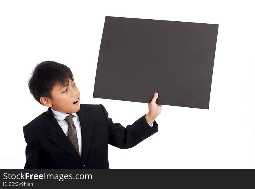 Young businessman in black suit holding placard