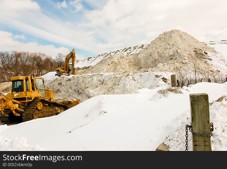 Storing collected snow in local park. Storing collected snow in local park