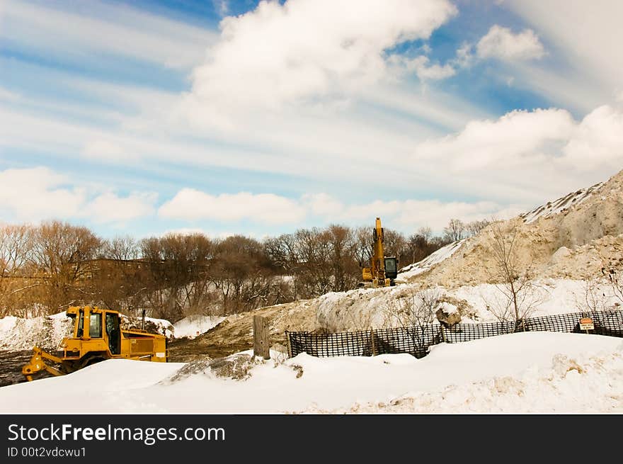 Storing collected snow in local park. Storing collected snow in local park