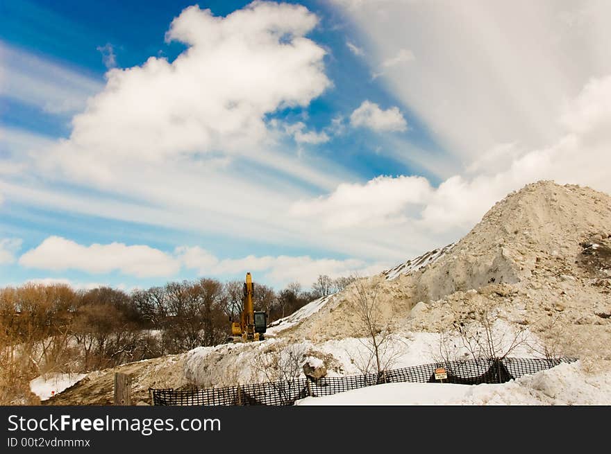 Storing collected snow in local park. Storing collected snow in local park