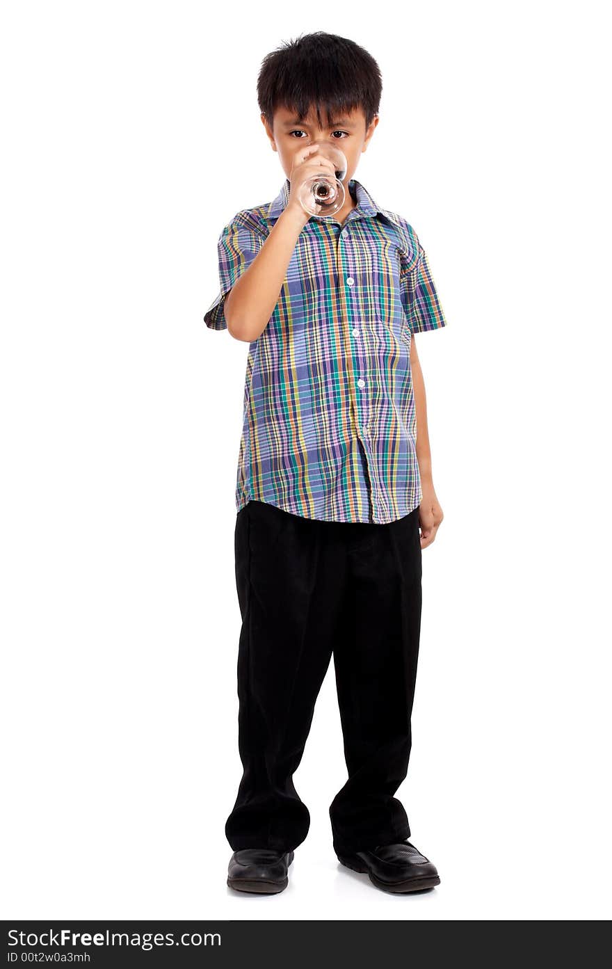 Young man holding a glass of cold tea