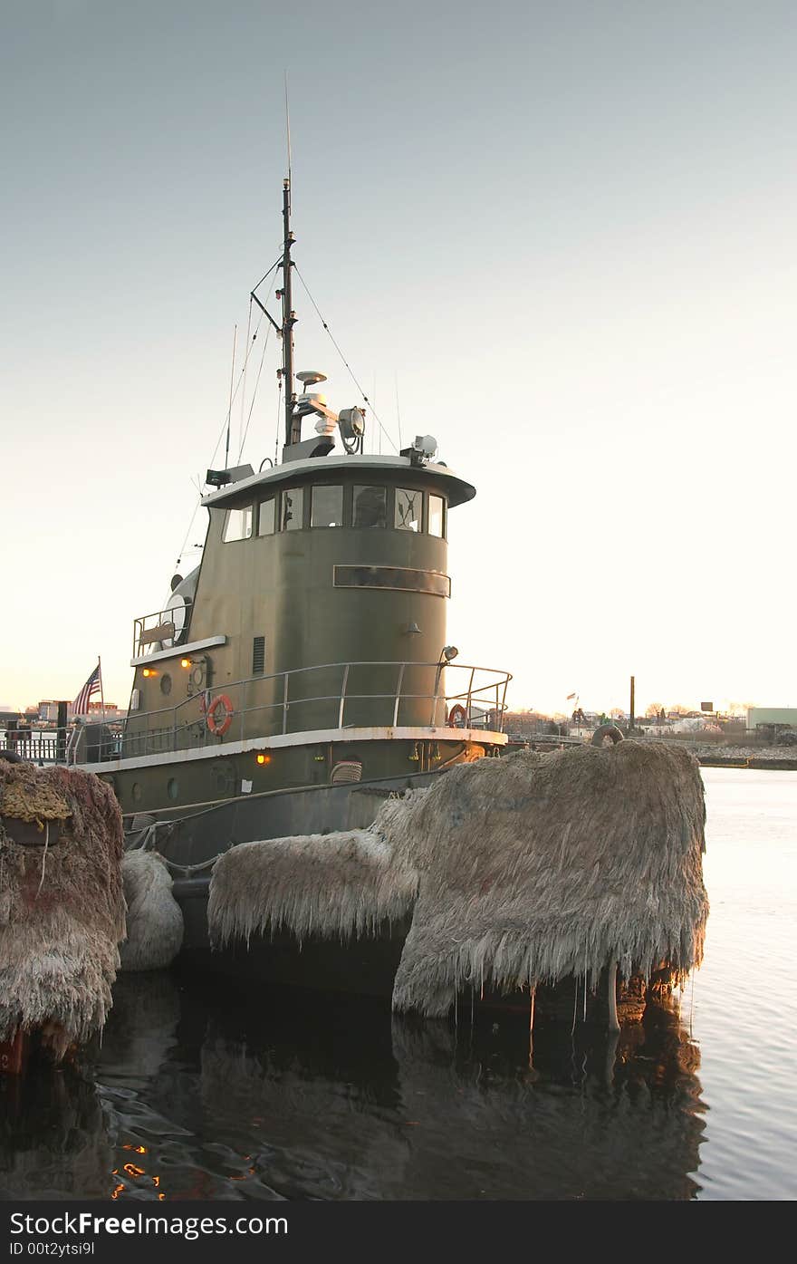 Tugboat docked in harbor