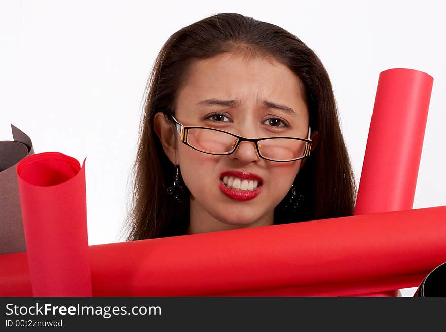 Frustrated young secretary carrying lots of plans