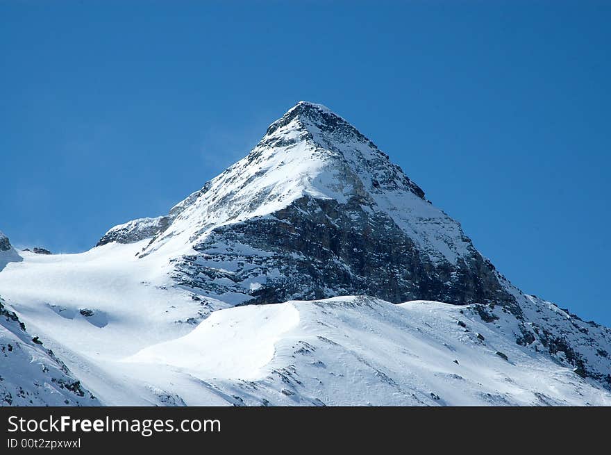 Snowy mountain on sunny winter day in Italian Alps. Snowy mountain on sunny winter day in Italian Alps